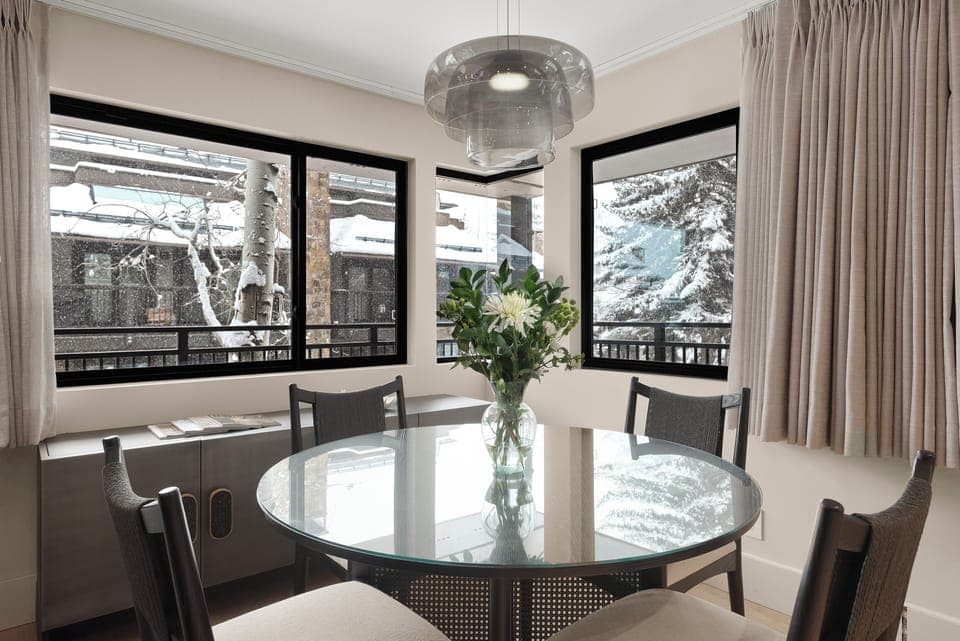 Gorgeous dining area surrounded by windows