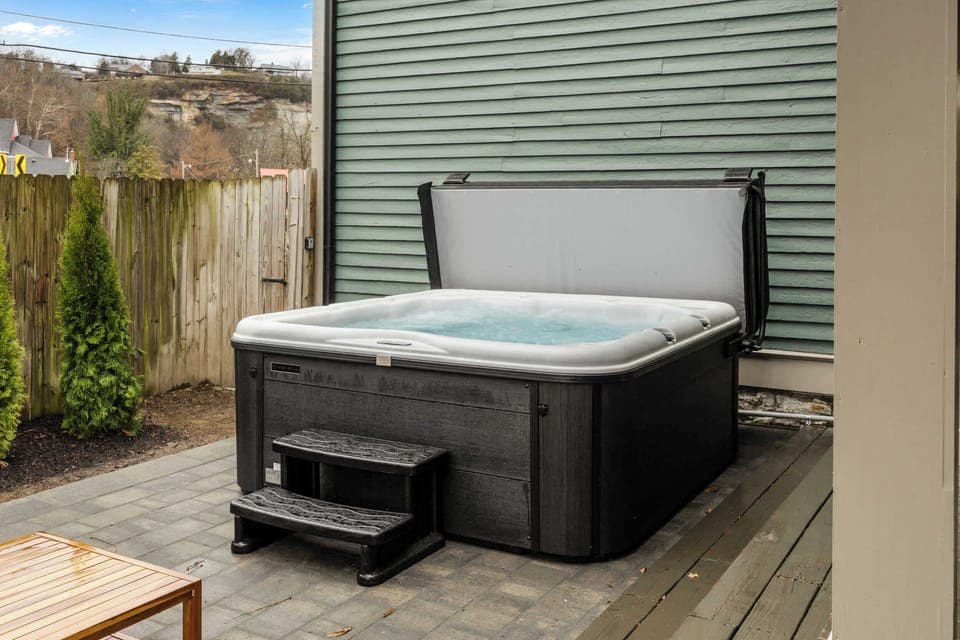 Backyard: After a day of adventures, gather your crew in this private backyard oasis. Soak your cares away in the large, modern hot tub while others relax and chat on the stylish patio seating just steps away. 