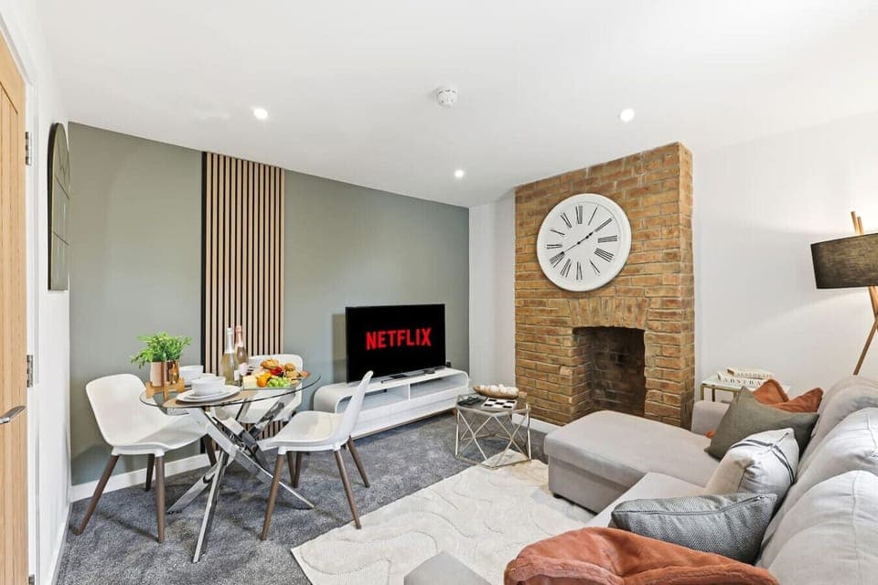 The second cosy living and dining area, complete with a 50” Smart TV with Virgin subscription and a comfortable corner sofa.