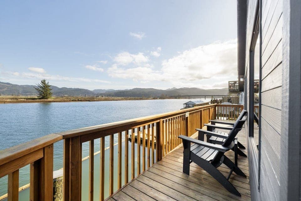 Relax on your private deck with stunning lake views, where comfortable chairs await your morning coffee or sunset moments.