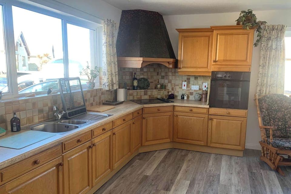 Large fully equipped kitchen includes 6 person dinner table, coffee machine and microwave