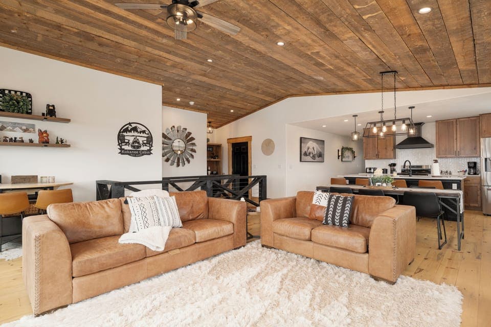 Sink into luxurious leather sofas beneath stunning wood beam ceilings in this open-concept retreat where mountain charm meets modern comfort at 224 GCR 4034.