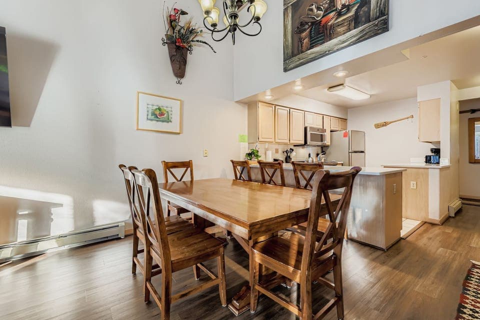 Gather around this elegant dining table where your family meals become cherished memories, with a fully equipped kitchen ready for your culinary adventures.