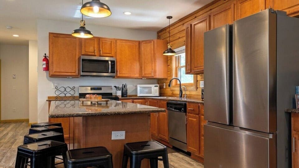 Fully stocked kitchen with stainless appliances & all essentials for your stay.