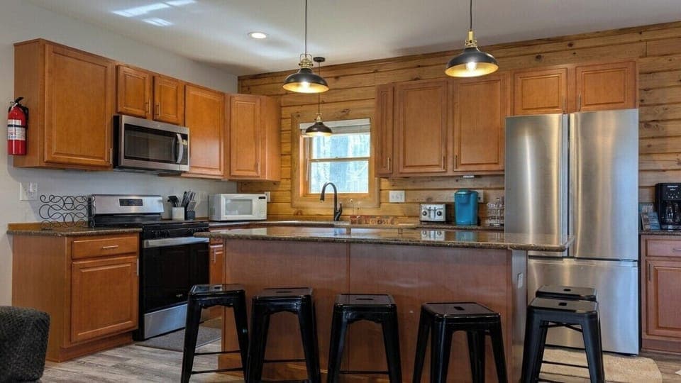 Fully stocked kitchen with stainless appliances & all essentials for your stay.