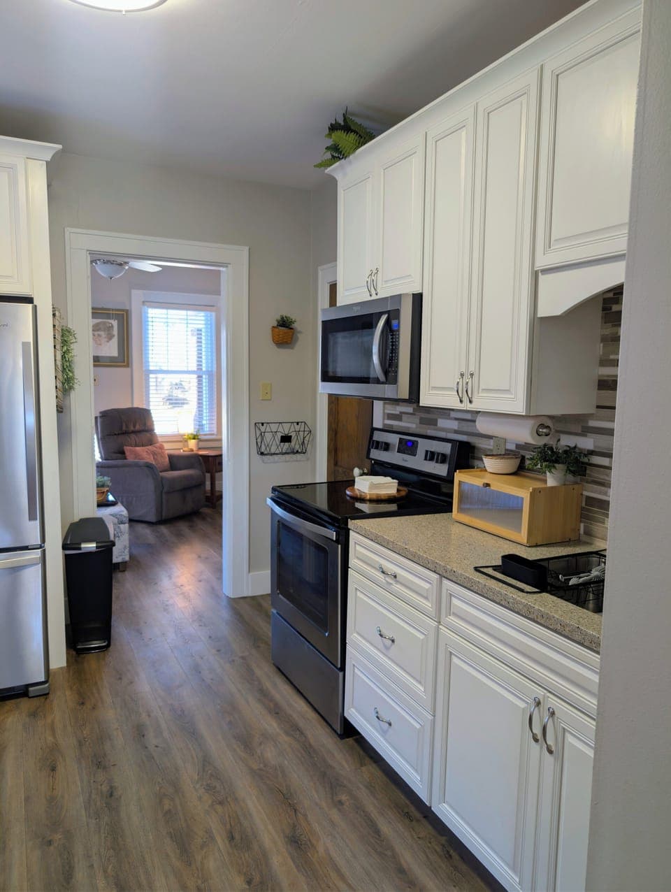 Kitchen with full sized appliances and cooking/baking essentials 