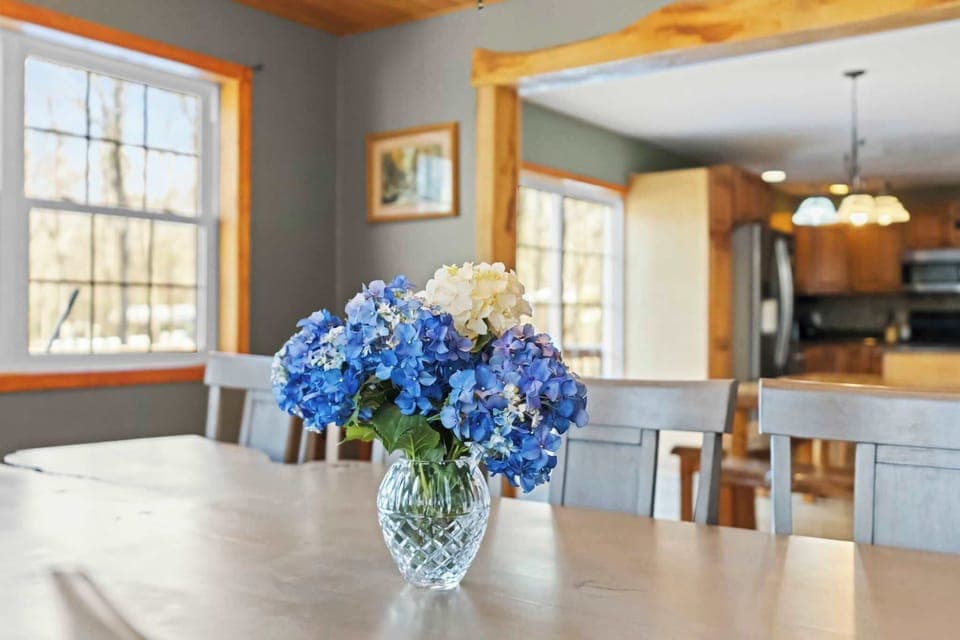 Fresh blue hydrangeas welcome you to the sunny dining table each morning