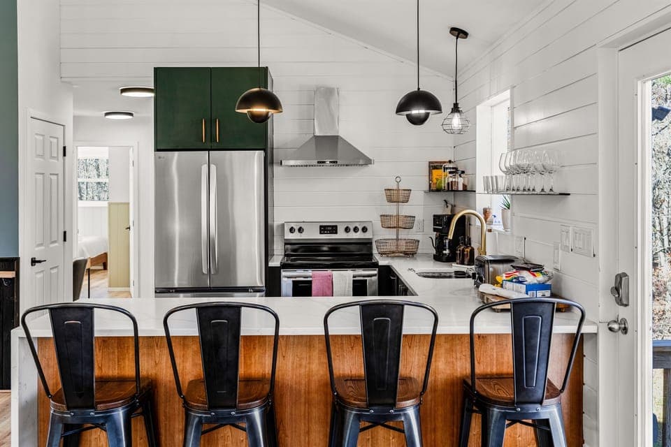 Enjoy casual dining and conversation at our spacious kitchen bar, with comfortable industrial-style stools—perfect for morning coffee or evening appetizers.