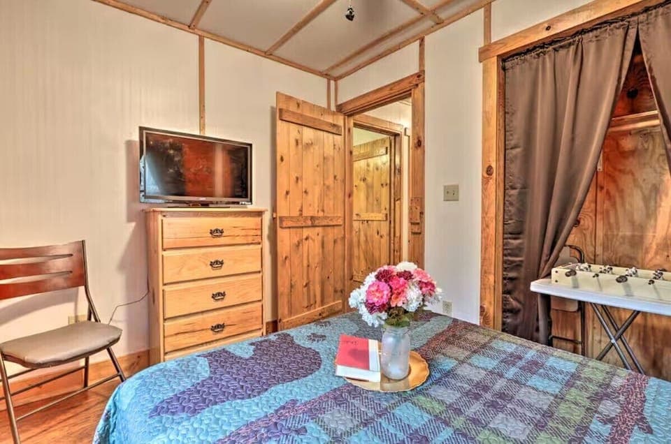 Bedroom with dresser and comfortable sleeping space