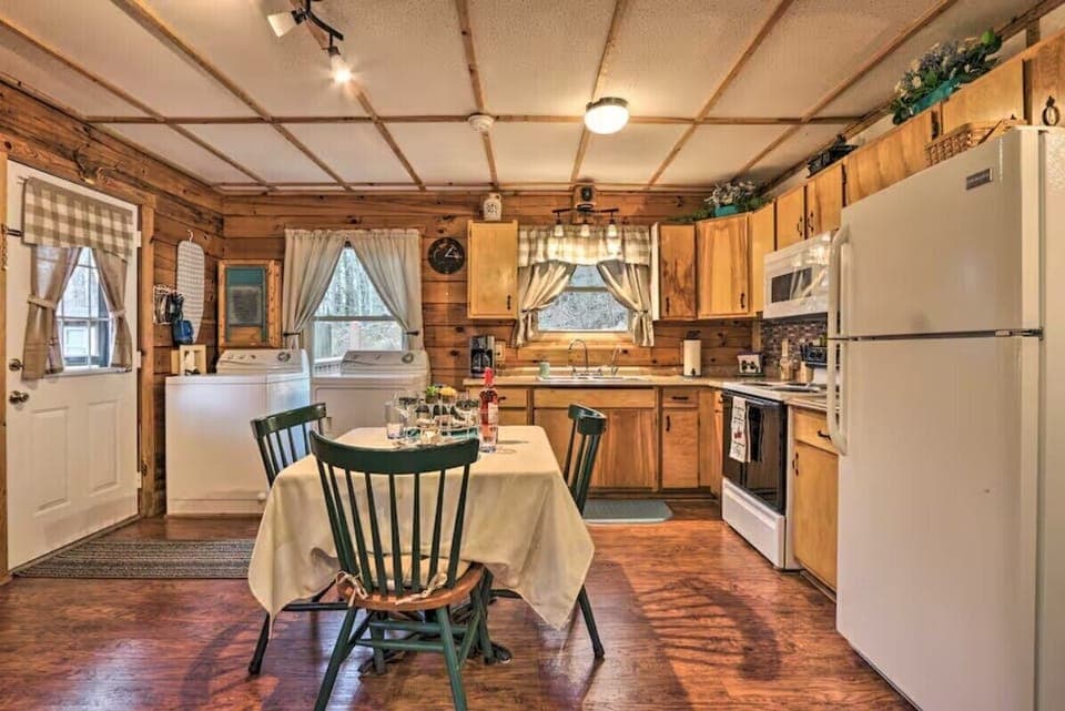 Open kitchen and dining area with rustic cabin interior