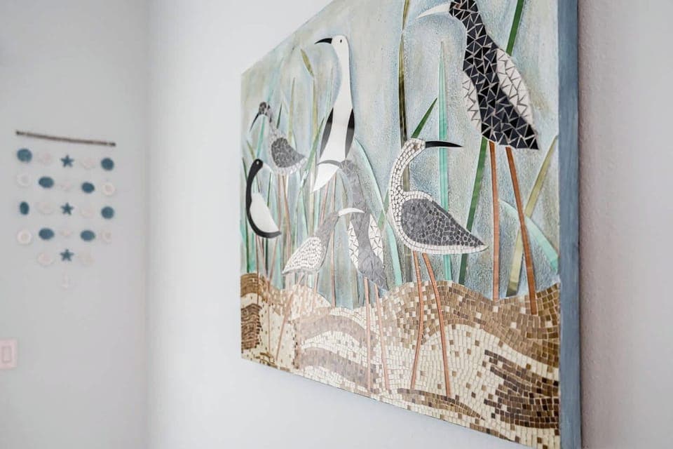 Coastal wall art adds a relaxing beach vibe