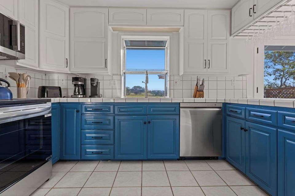 The kitchen offers a front-row seat to the backyard and open acreage. 