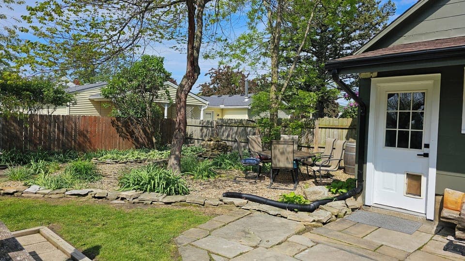 sitting and another eating area in backyard 