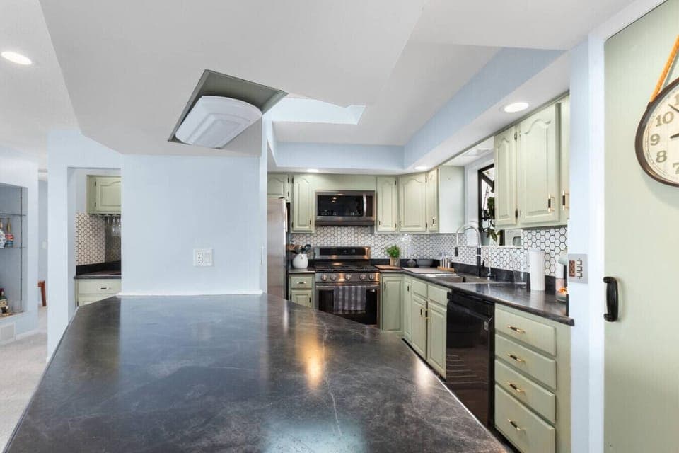Fully stocked kitchen with generous counter space and everything needed for group meals.
