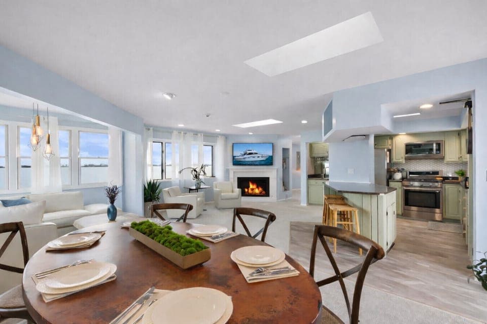 Bright dining space with easy access to the private waterfront deck