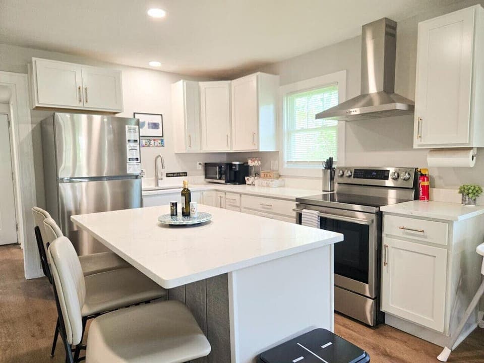 Cook with ease in a well-equipped kitchen with ample prep space and  electric oven