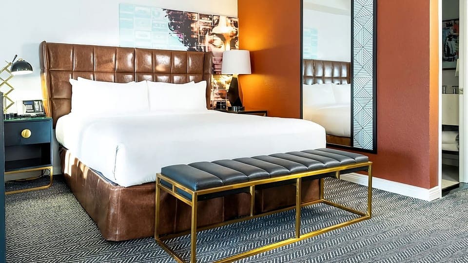 Sink into plush linens beneath bold, boutique-style artwork.