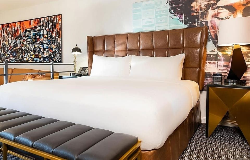Drift off beneath bold art and a cushy headboard.