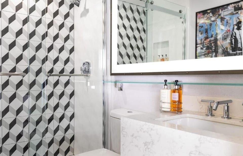 Refresh in a sleek glass shower with spa-like products.