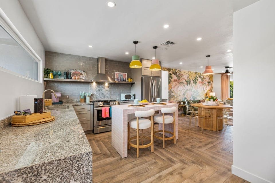 Bright, modern kitchen with colorful accents & island seating