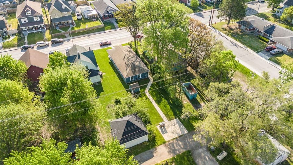 Charming home with lush yard, mature trees, and off-street parking