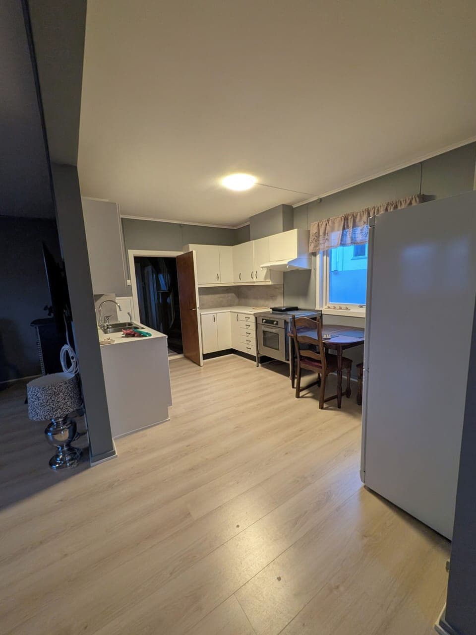 interior, indoor dining, kitchen, oven, refrigerator, stovetop, dining table