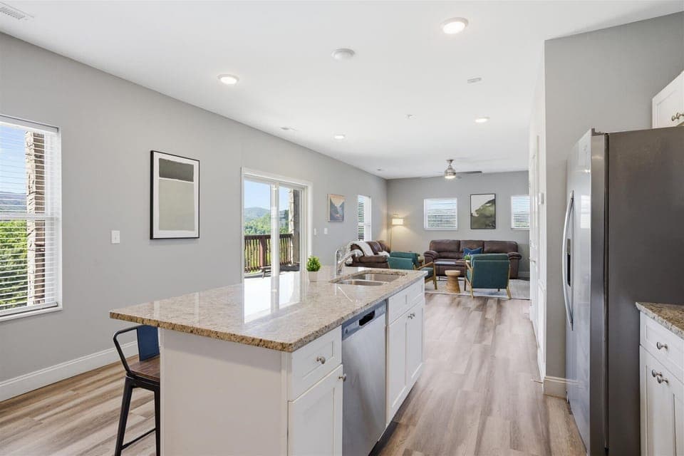 The kind of kitchen that actually works for a group—room to prep here, space to hang out over there, and nobody crowding each other. Spread out, keep the conversation going, and let the day naturally center around this space.