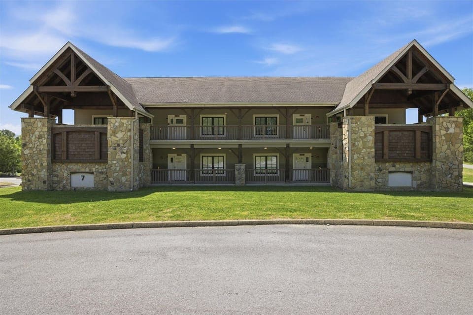 Welcome to Hearthstone Lodge at Serenity Ridge Resort, featuring four 4-bedroom/3-bathroom units that sleep up to 18 each. Enjoy two first-floor accessible units, dog-friendly stays, and access to the resort pool and clubhouse.