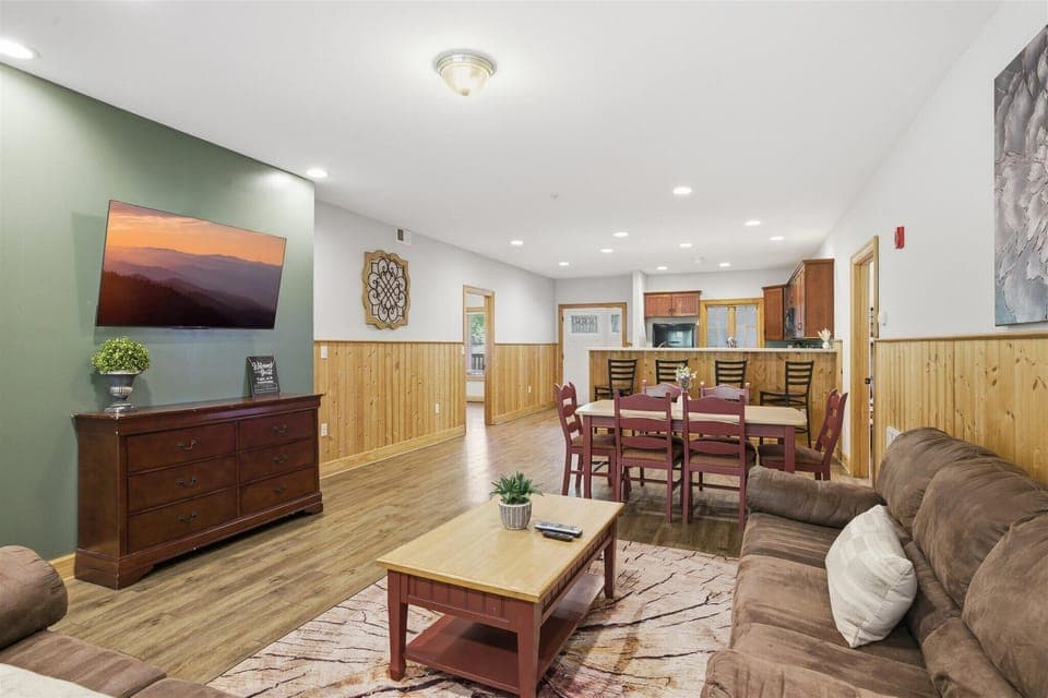 This is where everyone ends up—laughing, relaxing, and settling in together, with a space that feels open, comfortable, and made for shared moments.