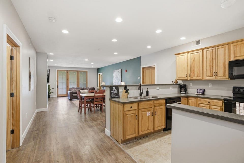 From the moment you walk through the door of Unit 712, the single-level layout opens into the kitchen, living, and dining areas, creating an easy flow that feels open, connected, and ready for your group to settle in.