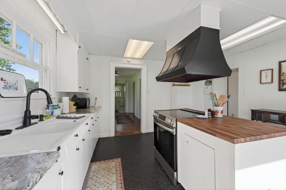 Bright kitchen with modern appliances and clean finishes.