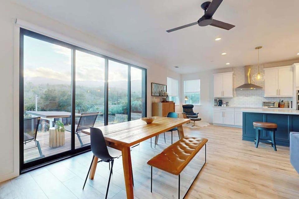 Savor farm-to-table meals at your hardwood dining table framed by floor-to-ceiling glass — morning coffee never looked better than with Sonoma Valley hillside views.
