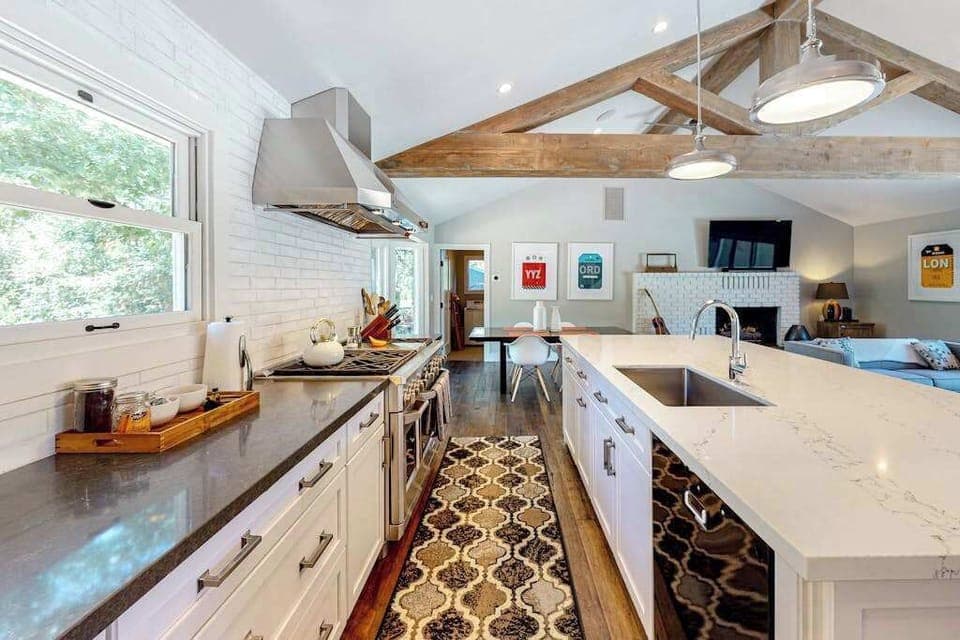 Prep your harvest-season feast on dual countertops with a farmhouse sink and curated spice display — every detail designed for your Sonoma culinary adventure.
