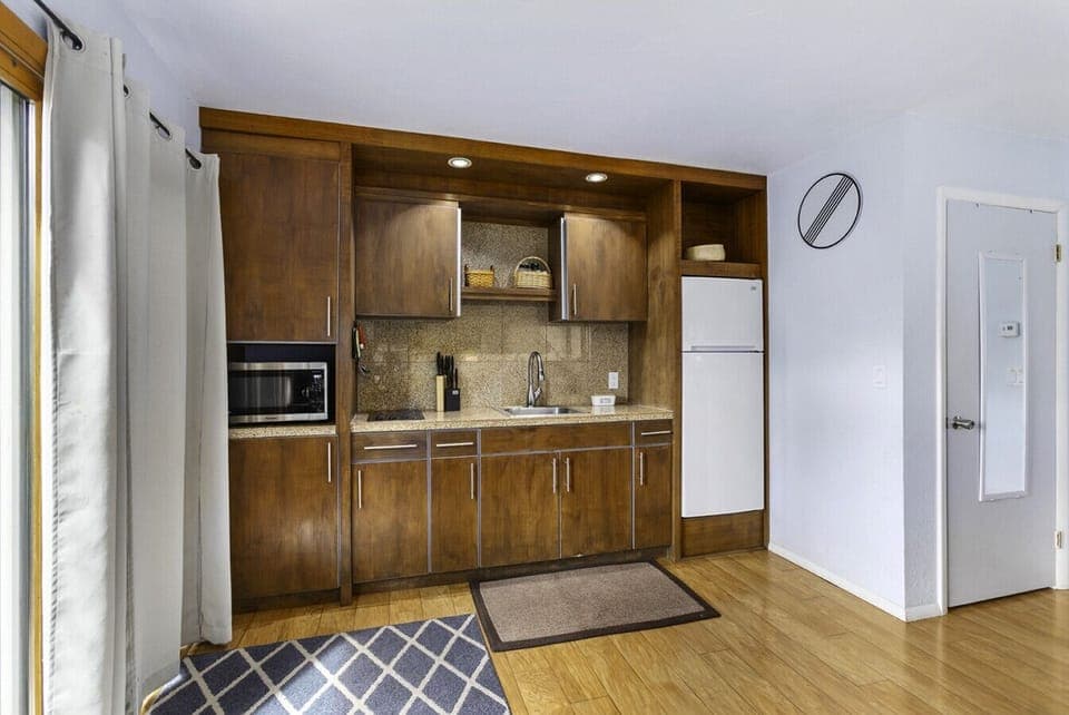 Kitchen area with modern cabinets!