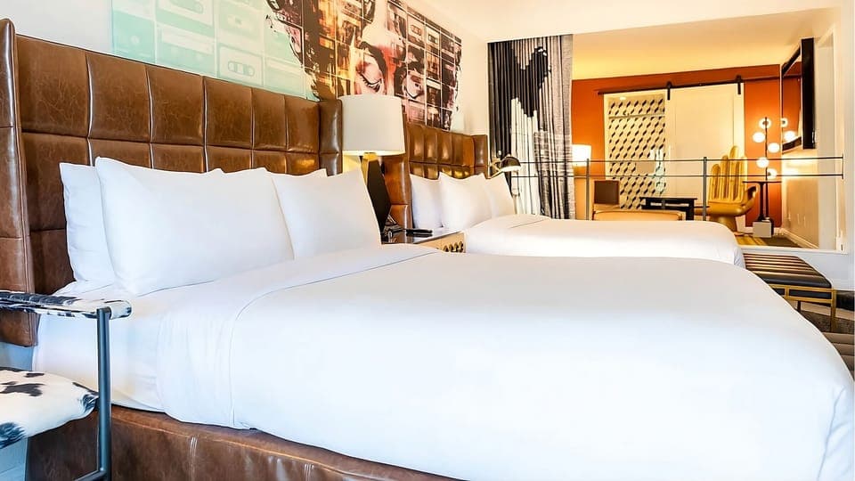 Stretch out on two cozy beds under warm, ambient lighting.
