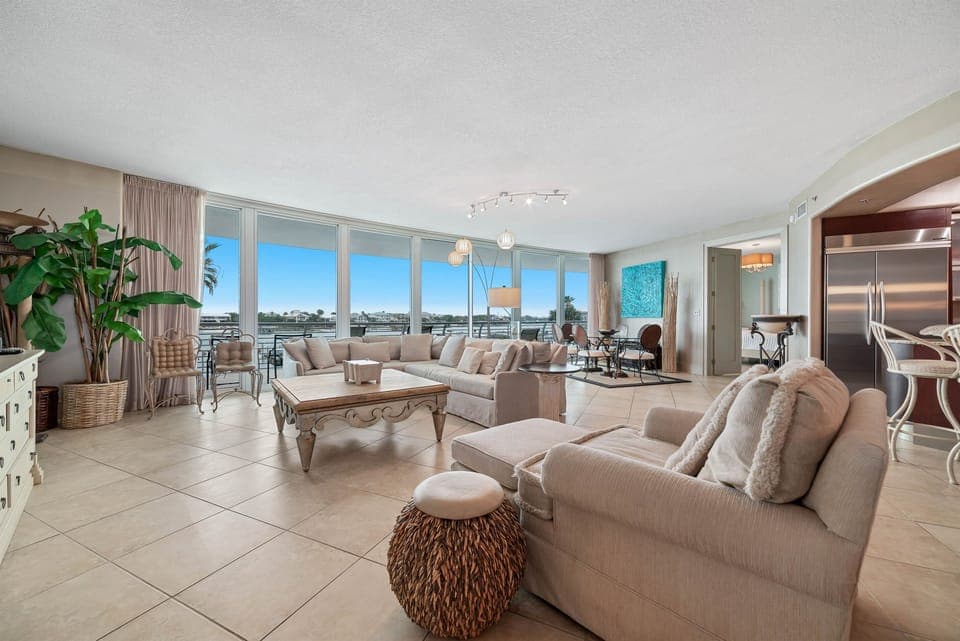 A light-filled living space with captivating views. This inviting room offers a perfect blend of comfort and style, creating a welcoming atmosphere for all.