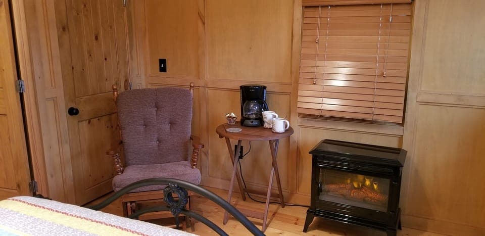 Cedar lined closet, comfy rocker, coffee maker and electric fire stove