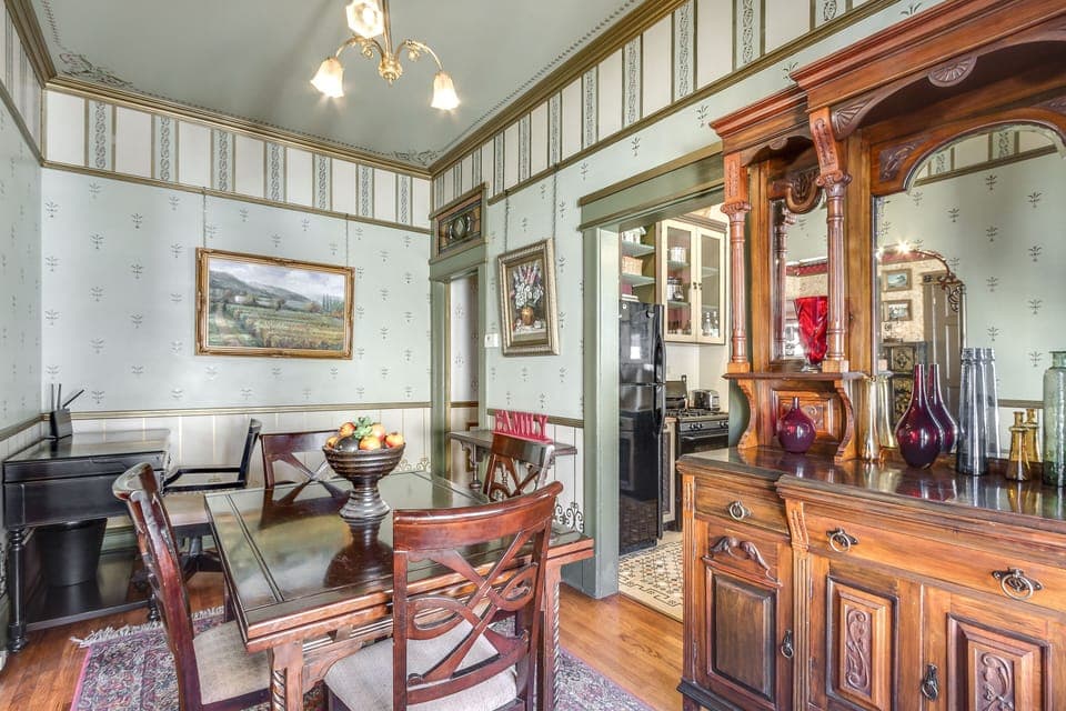 100 year old buffet, ormalou chandelier, desk and chair for work in corner.