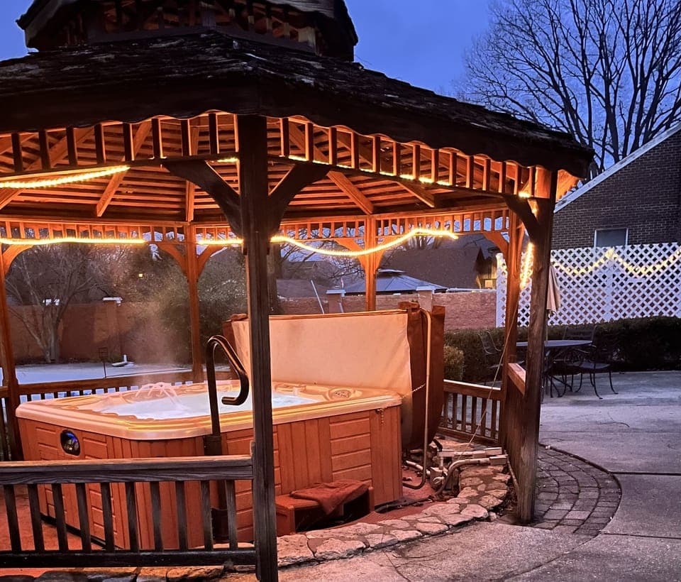 Hot tub and gazebo in the evening. 