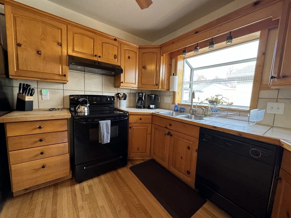 Kitchen with electric oven and range
