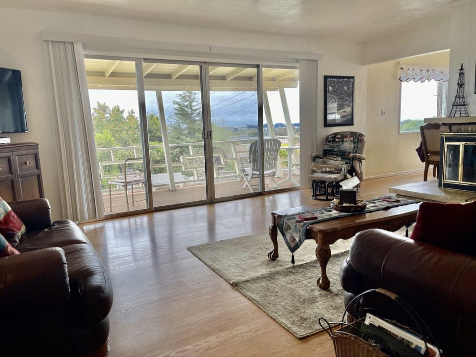 Main floor family room with views off deck