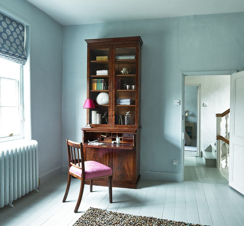 dresser bedroom 1 with view to bedroom 2 and stairs to second floor