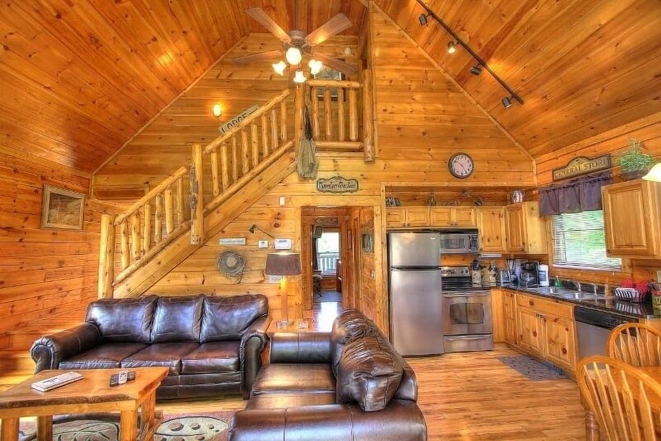 Living room with high vaulted ceilings.