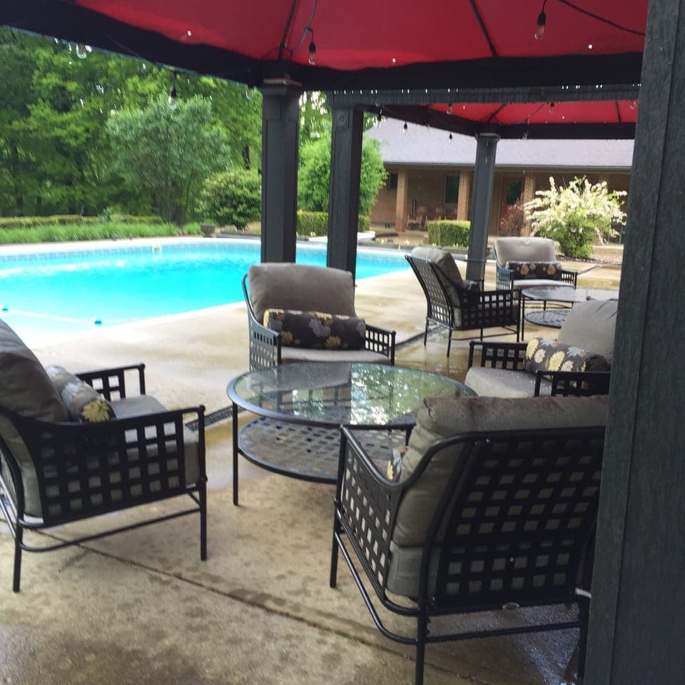 Poolside conversation areas, fire pit, outdoor dining, hot tub & porch w/rockers