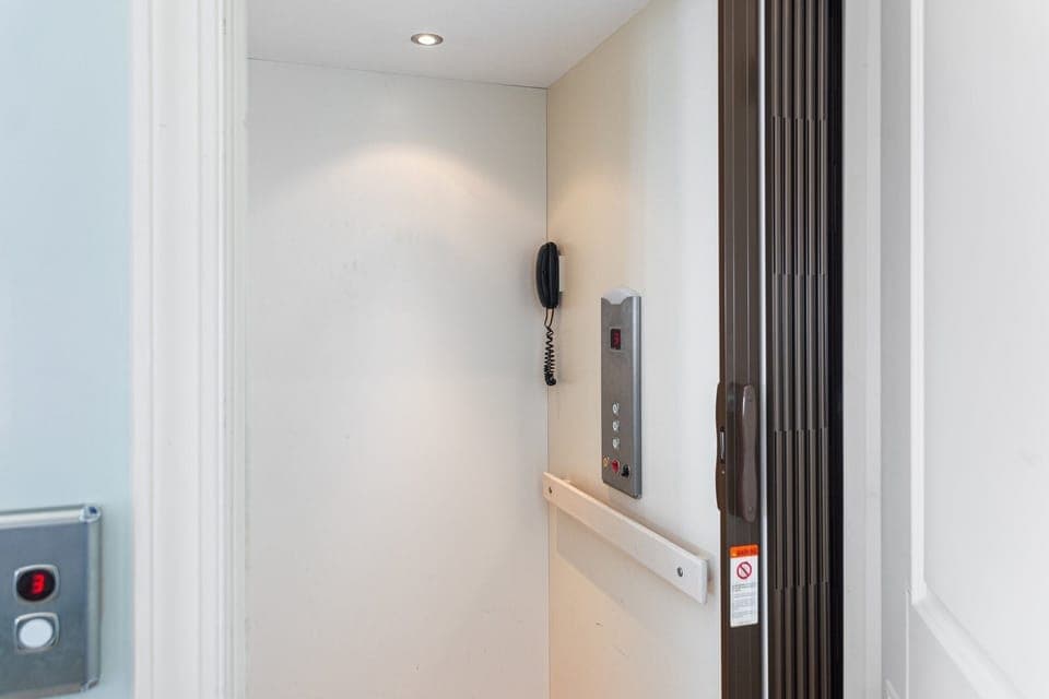 Elevator goes from ground level to top floor.