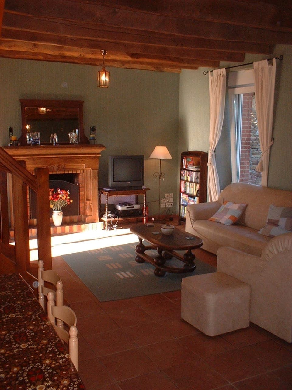 Comfortable lounge with open fireplace, sky TV and oak beamed ceiling