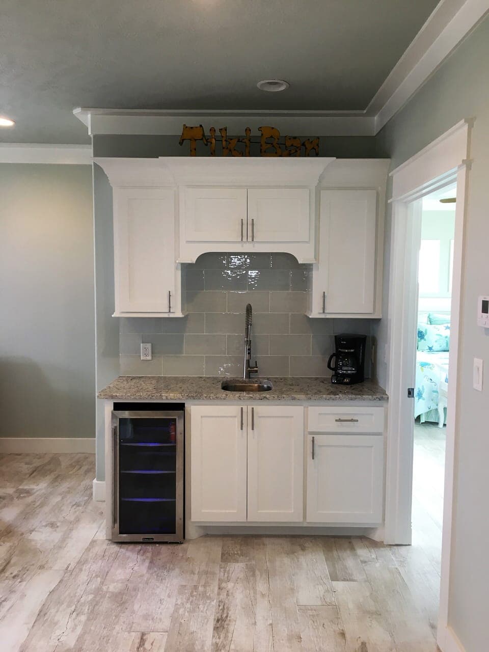 Upstairs coffee bar, sink, and beverage refrigerator