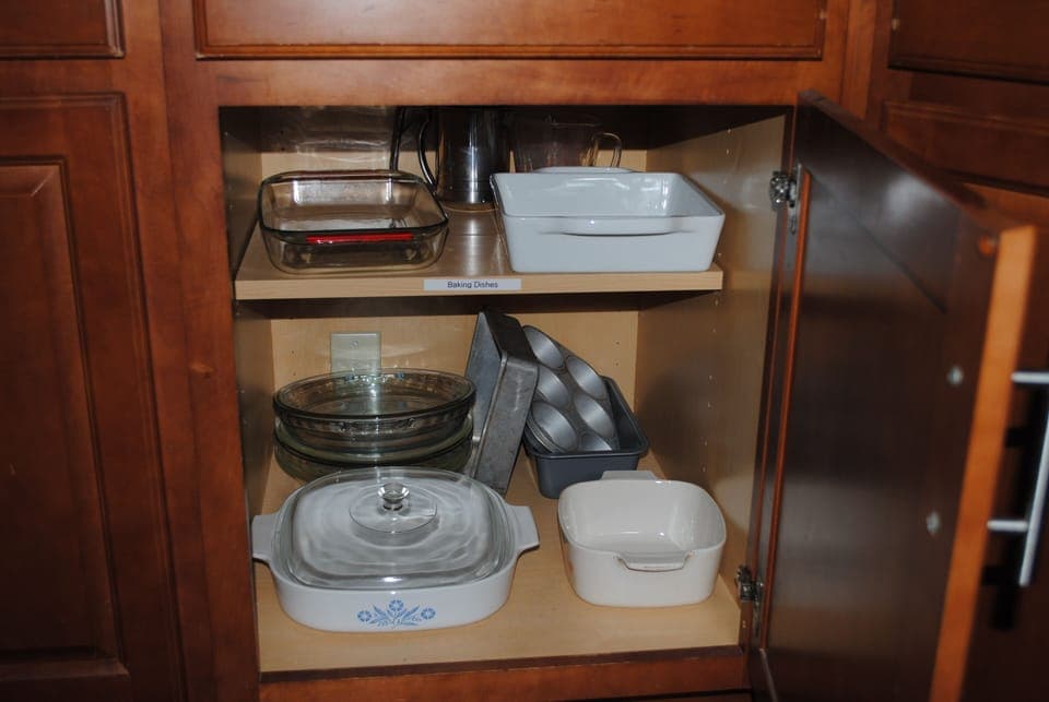 Cupboards supplied with dishes and labeled.