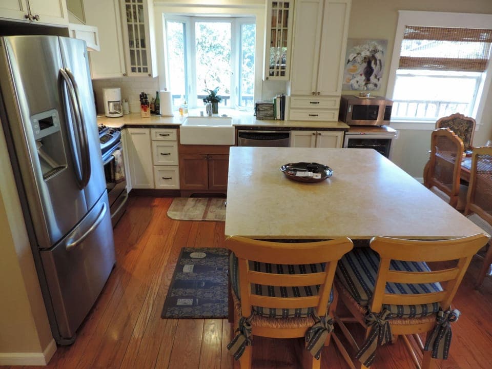 Kitchen with farm sink and bay window