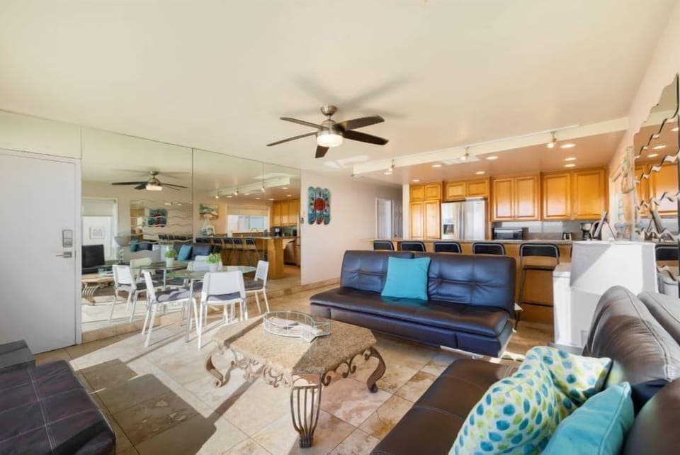 Living room looking back at kitchen, counter, washer & dryer